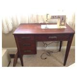 vintage Singer in cabinet, works