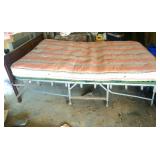 vintage fold-away double bed with metal headboard