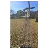 primitive windmill on metal stand