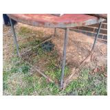 rusty round metal table