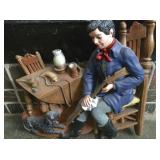 chalkware man cleaning gun
