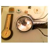 Vintage thermometer and chrome GE spotlight with car-lighter attachment