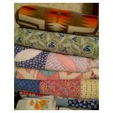 Stacks of handmade quilts