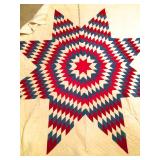 This starburst quilt has a creamy corduroy background