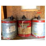Vintage gas cans, including Standard Oil (center)