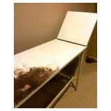Metal utility table in upright position