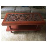 Deep Carvings in this Unique Vintage Coffee Table. Glass Top. 43"L x 20"x 19"h Lot Number: 3