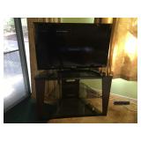 Samsung 40" TV Model# LN40E550F7F, Corner Tempered Glass & Metal TV Shelf. Lot Number: 11