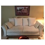 Stylish White/Cream Sofa with Pillows, some spots need cleaning but in Great condition. Approx. 7.5 