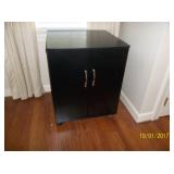 Small black cabinet on wheels
