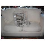 Cream colored love seat