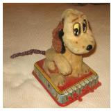 Lifts paw & wags tale