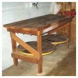 Wood work bench w/rotating tool storage underneath