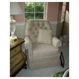 Beige swivel rocker chair