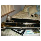 Trombone in case with muffler