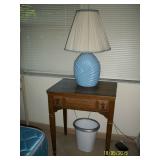 Singer sewing machine in cabinet, blue lamp