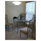Round glass top table with 4/chairs