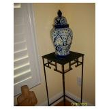 Metal plant stand and large blue and white ginger jar