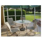 Tropitone Table , umbrella and 4 swivel chairs