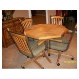 Table with 4 chairs and 1 leaf