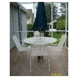 Painted white metal patio table with 4 chairs and umbrella