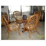 Round wood table with 4 rattan chairs