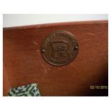 Company metal name tag inside top drawer