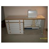 Sewing cabinet/table has chair