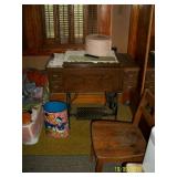 Antique sewing machine and cabinet