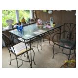 Metal table with glass top and 4 chairs