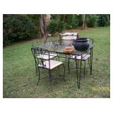 Black metal table with glass top and 4 chairs