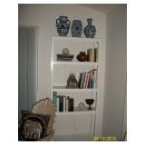 Plastic shelf, books and pottery