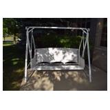 White wicker outdoor swing 