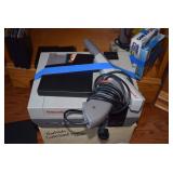 Nintendo with controller, Mario Bros. Game and gun