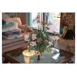 Glass top coffee table, floral arrangement