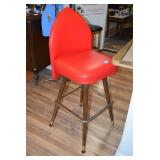 Bar stool with red cushion