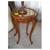 Round glass-top side table