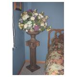 Artificial floral piece on stand