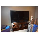 Flat Screen TV, Stand, & Vacuum Cleaner