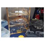 Gold Shelving Unit, Costume Jewelry, Gloves, & Blankets