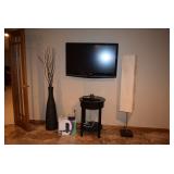 Flat Screen TV, Floor Lamp, Accent Table, Vase W/Floral Accents