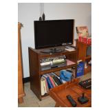 Flat Screen Television, Stand, Books, Atari Gaming Unit