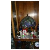 Tiffany style lamp, clocks, figurines 