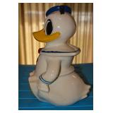 USA, Circle with a crown at top, and word Celebrate and Reg US Patent Off embedded in ceramic; may h