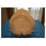 USA, Circle with a crown at top, and word Celebrate and Reg US Patent Off embedded in ceramic; may h