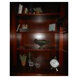 bookshelf plants and clock