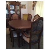 dining room table with pads and chairs 