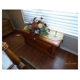 wood chest and floral arrangement 