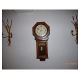 wall clock and sconces 