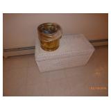 wicker trunk and small garbage can 